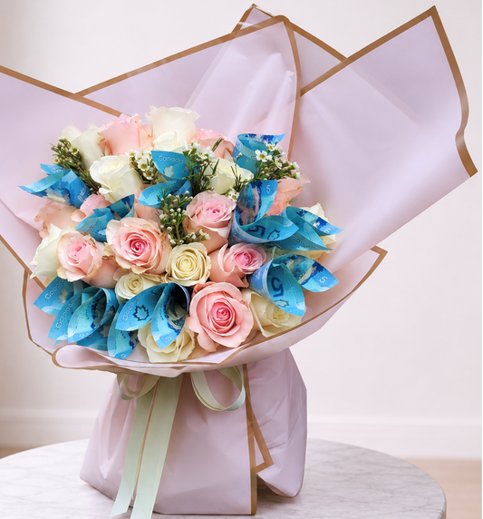 Gilded Petals 24 rose money bouquet in Toronto with pink and white roses and blue Canadian bills