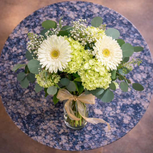 top view white flower arrangement Toronto with hydrangeas and eucalyptus greenery