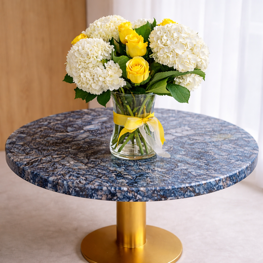 Side view of Luminous Meadow bouquet in glass vase