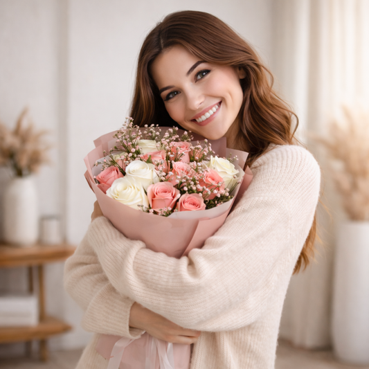 Woman holding Blush Reverie Box flower bouquet