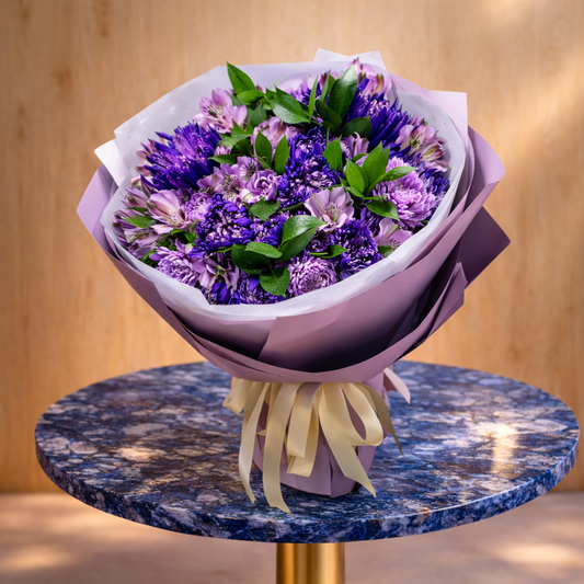 Elegant purple flower bouquet Toronto with violet and lavender tones displayed on marble table