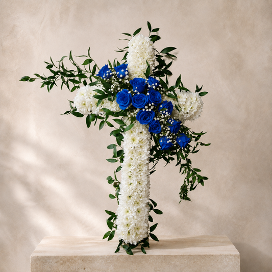 Eternal Grace memorial cross arrangement with blue roses for Toronto funeral delivery