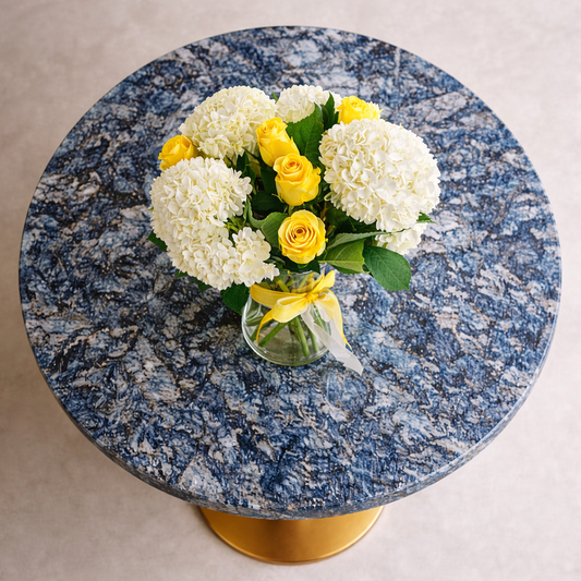 Top view of white hydrangeas and yellow roses arrangement
