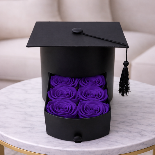 Preserved roses inside graduation cap box