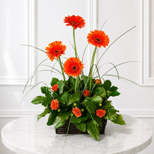 Luxury flower delivery Toronto arrangement with orange gerbera daisies on marble table