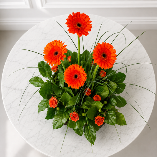 Modern luxury flower delivery Toronto top view floral arrangement with orange flowers
