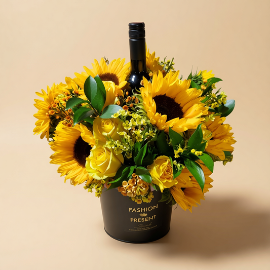 Sunflower and yellow rose floral arrangement with wine by Toronto flower delivery