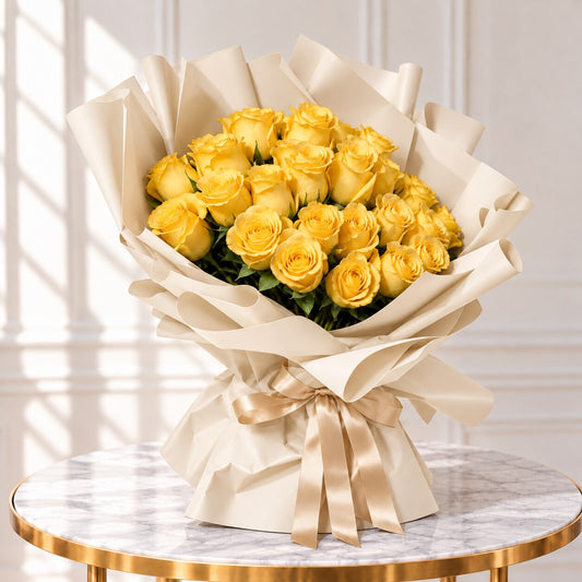Overhead view of yellow roses with natural petal textures, green leaves and folded ivory paper