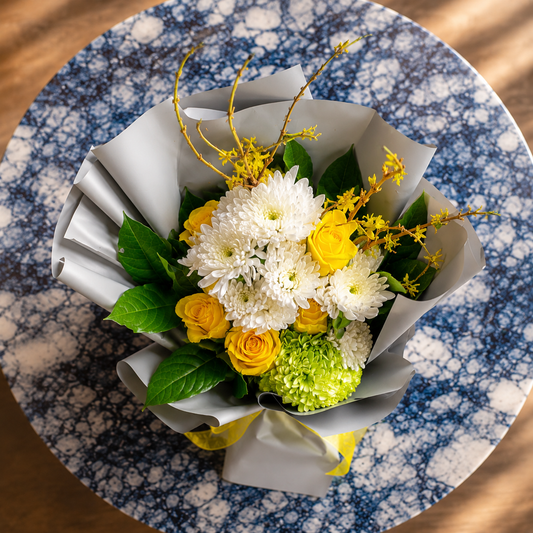 Top view of a premium yellow flower bouquet with fresh roses and chrysanthemums available for same day flower delivery in Toronto and Mississauga.
