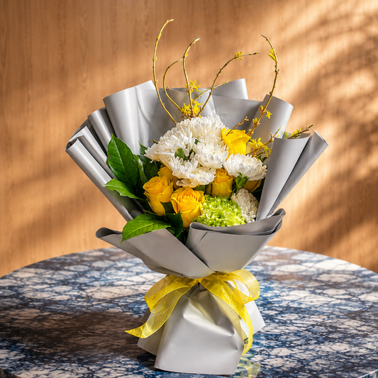 Yellow flower bouquet Toronto handcrafted with fresh yellow roses, white chrysanthemums, and seasonal greenery by Amarilis Flowers.