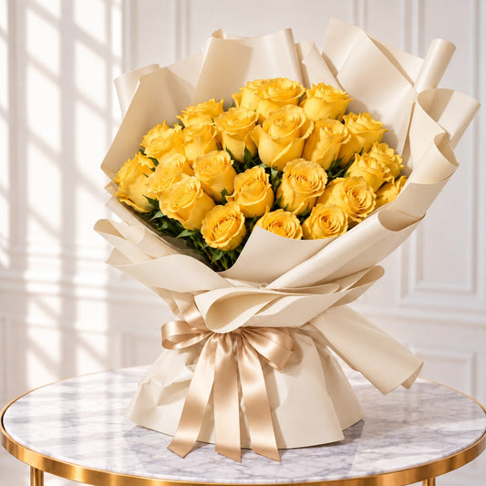 Left-side view of golden yellow roses in ivory paper tied with a champagne-coloured bow