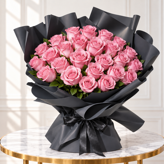 30 pink roses bouquet with green foliage, sculpted black wrapping and a black ribbon.