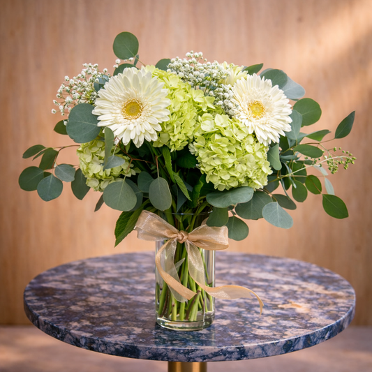 white flower arrangement Toronto with gerberas hydrangeas in glass vase by Amarilis Flowers