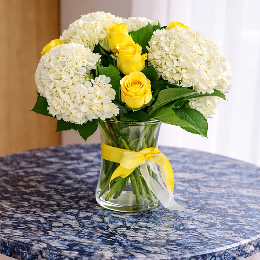 Side view of Luminous Meadow bouquet in glass vase Richmond Hill