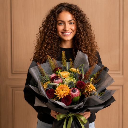 Woman holding birthday flower delivery Toronto luxury bouquet