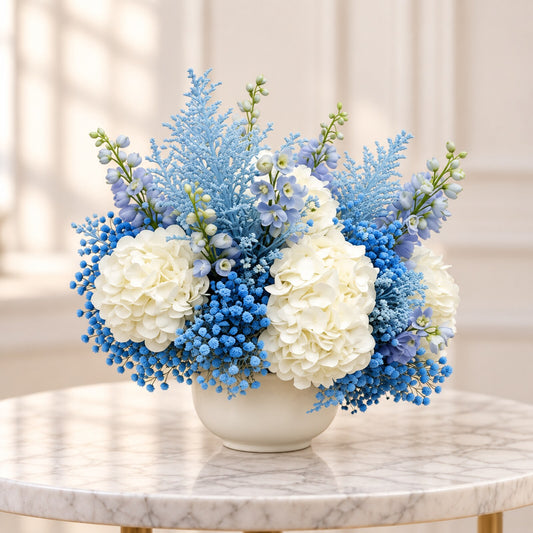 Blue and white baby welcome arrangement available for flower delivery in Toronto and the GTA