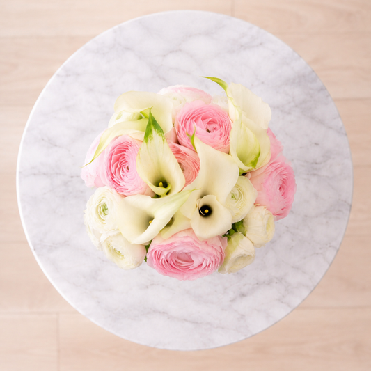 Top view of Blush Cloud calla lily bridal bouquet with pink and white ranunculus