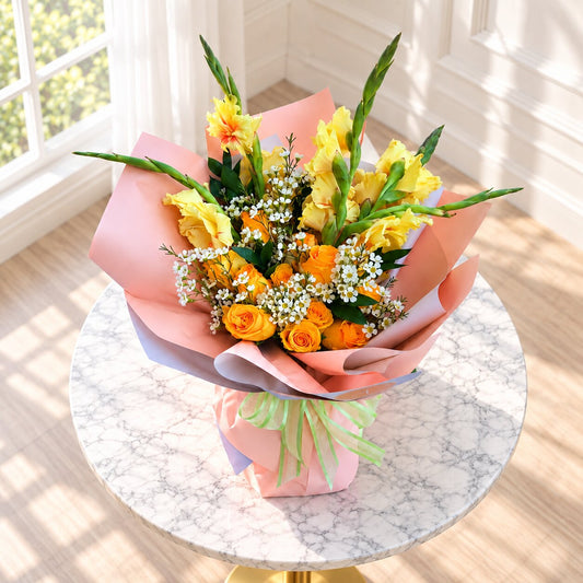 Top view of Golden Sunrise fall bouquet with orange roses and yellow gladiolus