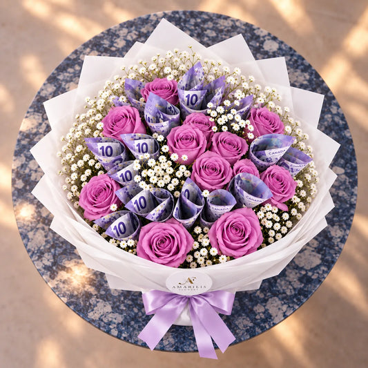 Overhead view of Lavender Fortune showing purple roses, folded Canadian banknotes and white baby's breath.