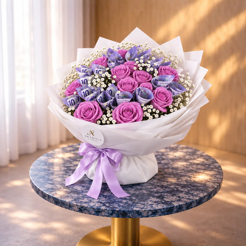 Side view of Lavender Fortune with layered white wrapping and a lavender satin bow on a marble table.