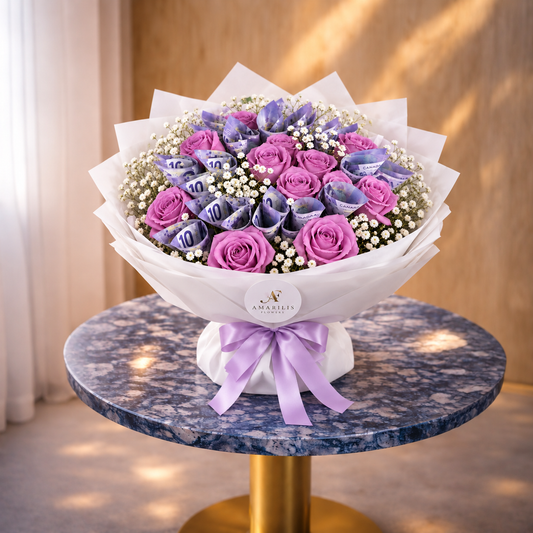 Lavender money bouquet with purple roses, Canadian $10 bills and white wrapping on a marble table.