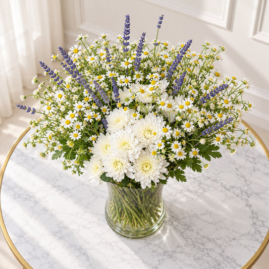 Overhead view of white chamomile daisies, layered chrysanthemums and lavender spikes