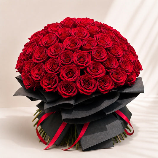 Luxury red rose bouquet with elegant black wrapping for romantic flower delivery in Toronto and the GTA.