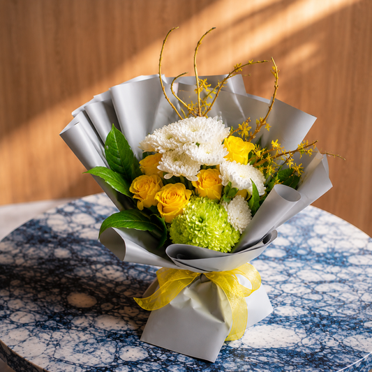 Luxury yellow flower bouquet featuring fresh roses, white chrysanthemums, and elegant wrapping for flower delivery in Toronto, Mississauga, and the GTA.