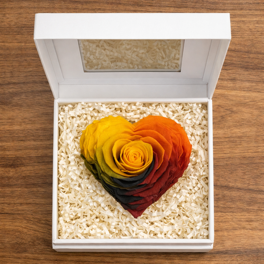 Multicolor preserved rose heart presented in a premium display box.