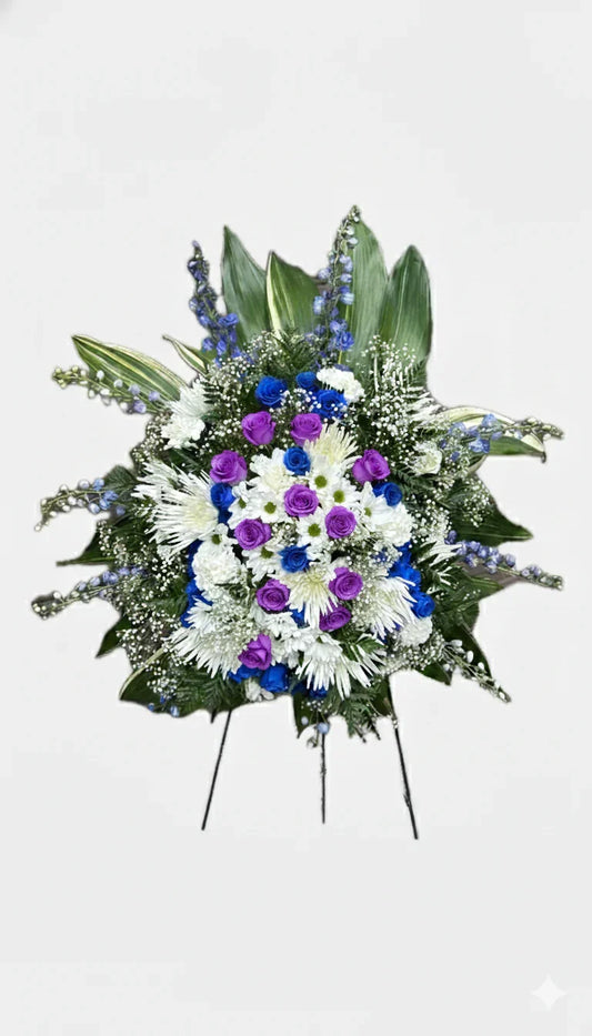 Blue and white standing floral arrangement for memorial service
