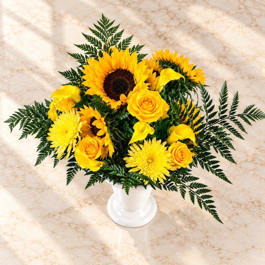 Top view of Golden Tribute with yellow sunflowers, roses, chrysanthemums and fresh fern greenery