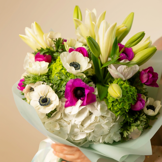 White and green floral arrangement in Toronto with soft elegant blooms