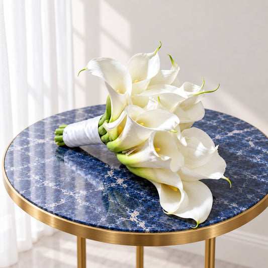 Top view of ten white calla lilies arranged as a modern wedding bouquet